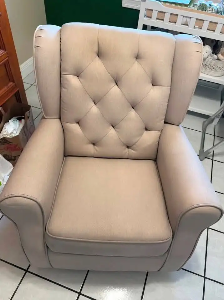 Beige buttoned nursing chair with even, clean upholstery after cleaning