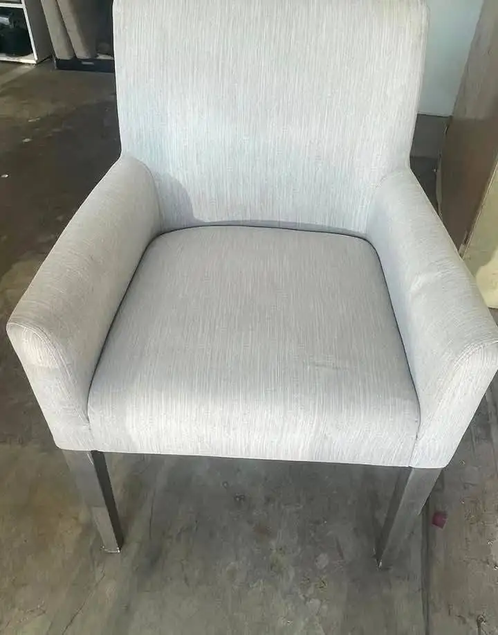 Pale grey dining armchair with even, clean upholstery after cleaning